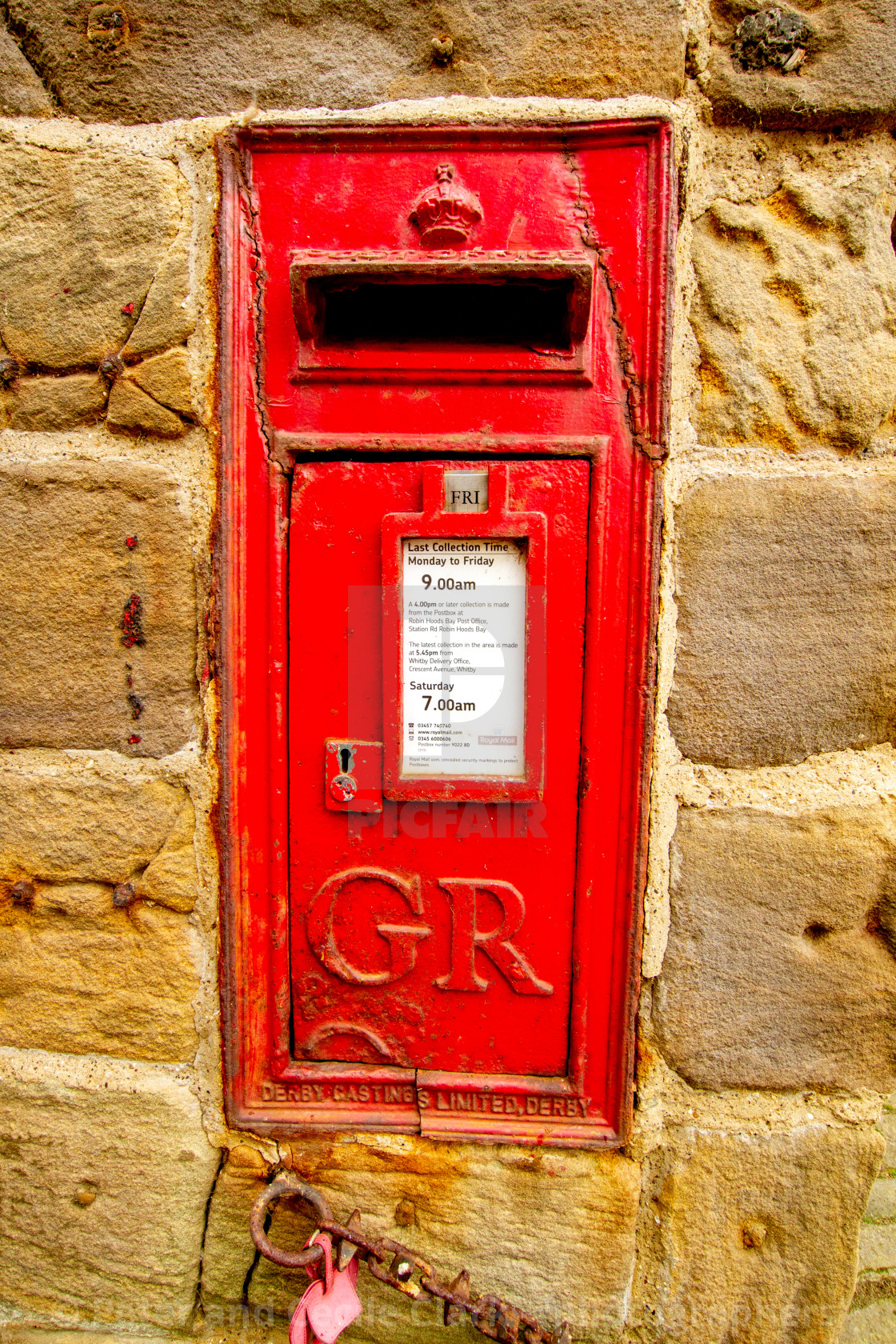 "Red British King George post letter box at The Dock, King Street, Robin Hoods Bay, Yorkshire, England." stock image