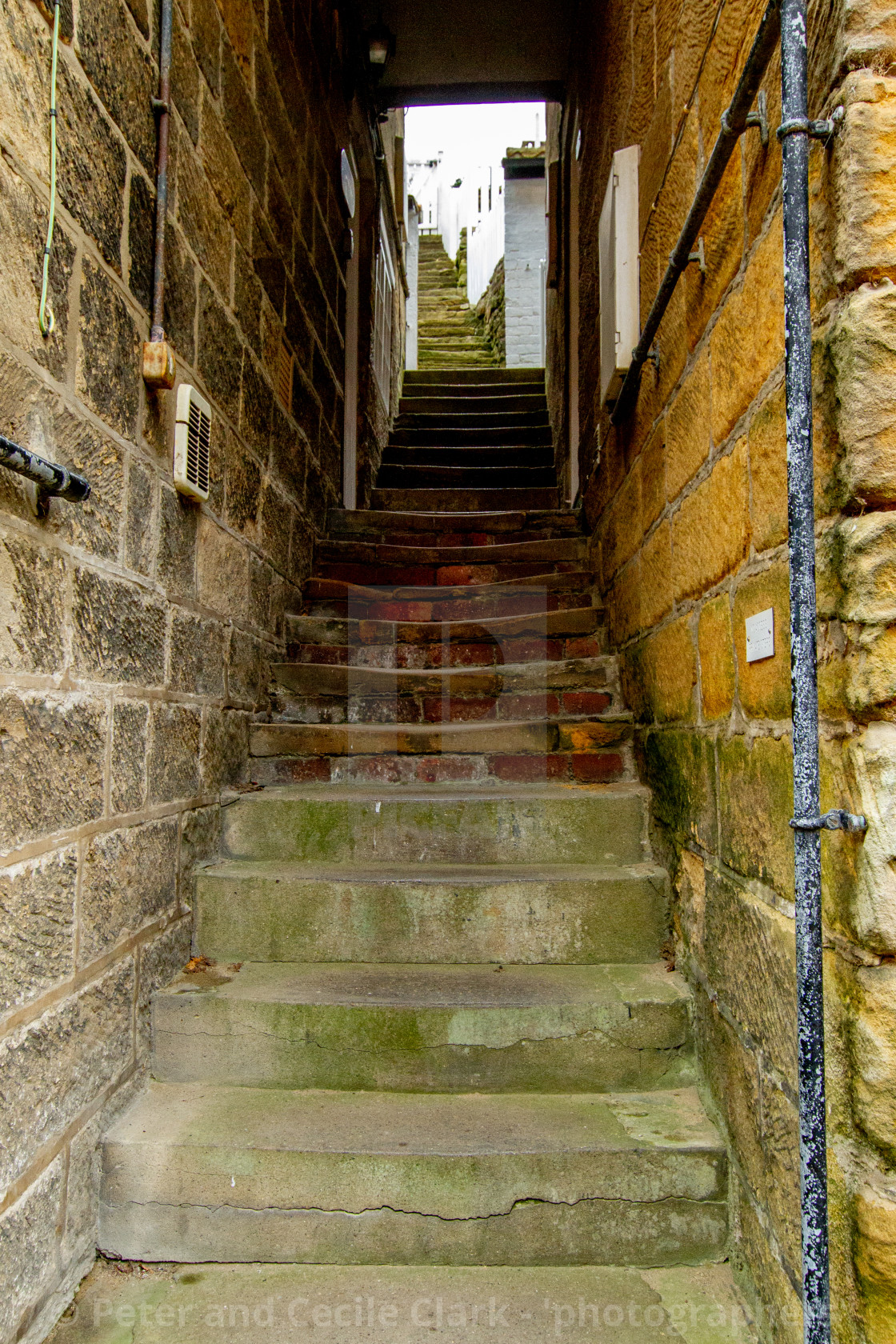 "Robin Hoods Bay, Yorkshire East Coast, Narrow Ginnel with Steps" by Peter and Cecile Clark - 'photographers' - $25.27 "Robin Hoods Bay, Yorkshire East Coast, Narrow Ginnel with Steps" stock image