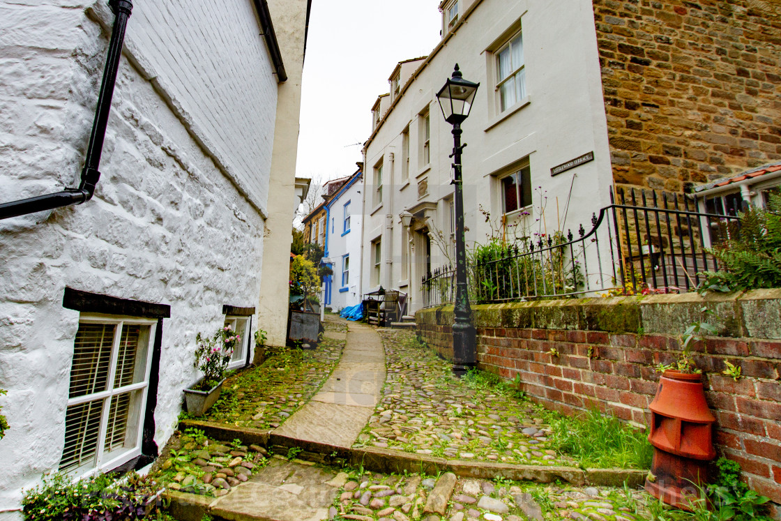 "Stone Flagged Path with Cobbles leading to Littlewood Terrace, Robin Hoods Bay East Yorkshire Coast." stock image