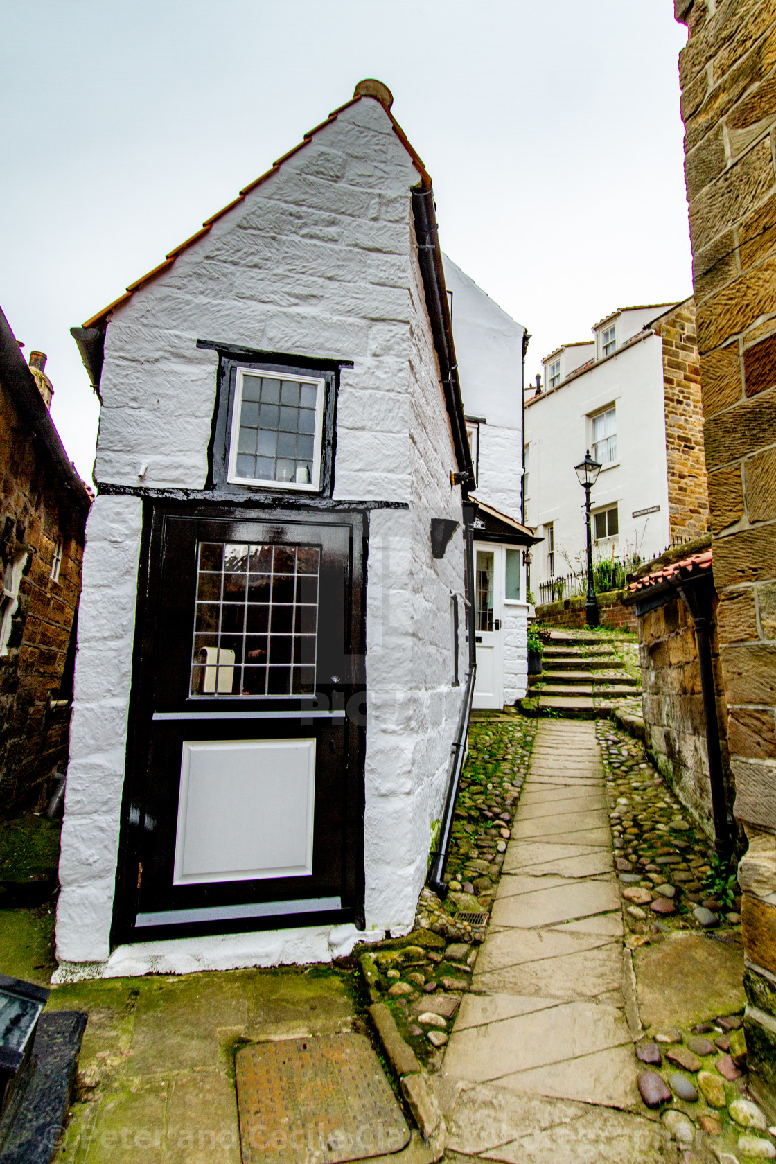 "Stone Flagged Path with Cobbles leading to Littlewood Terrace, Robin Hoods Bay East Yorkshire Coast." stock image