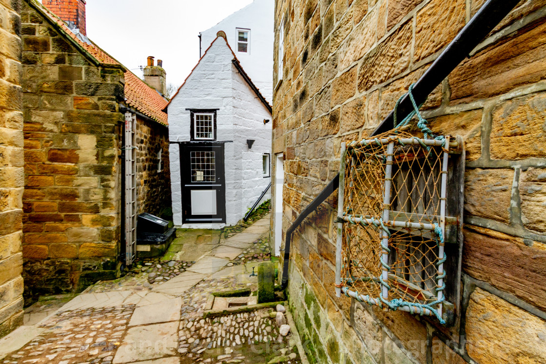 "Robin Hoods Bay, Yorkshire East Coast, England. Narrow Ginnel with Stone Cobbles." stock image