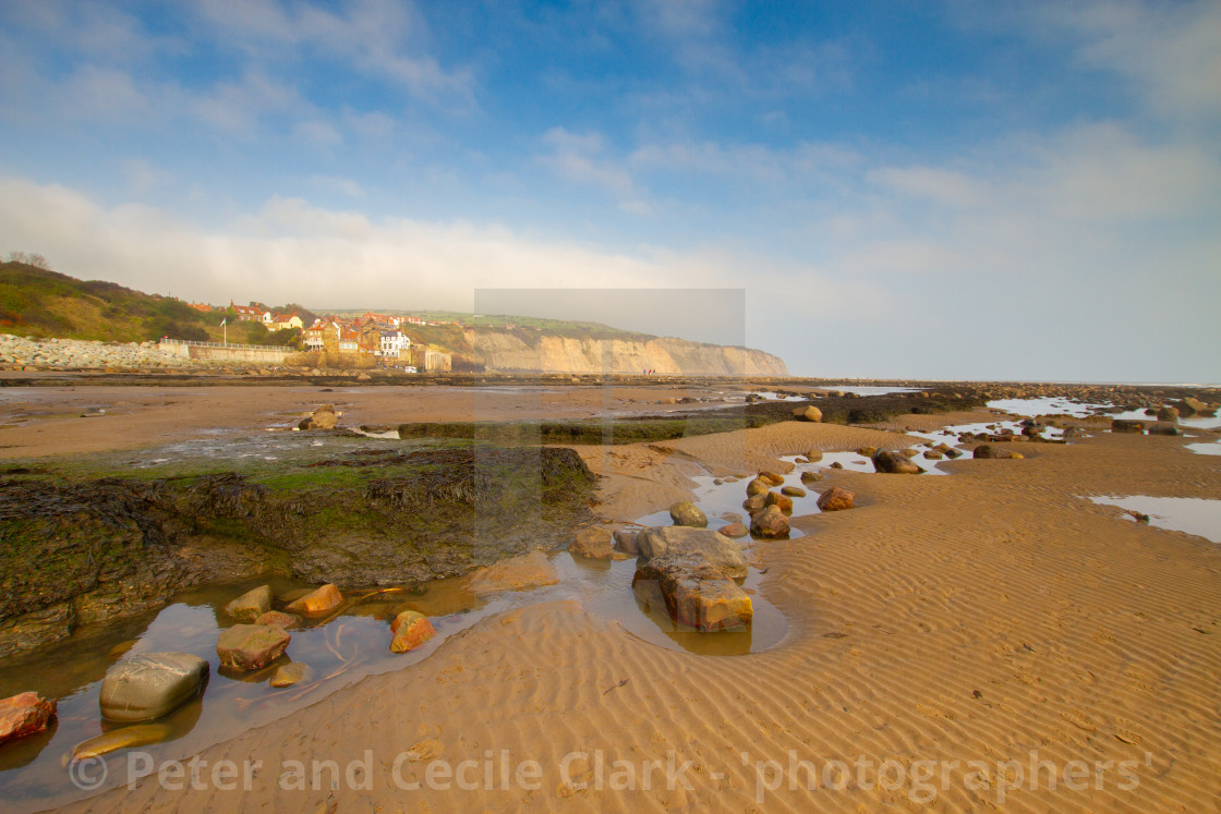 "Rockpools and Beach at Robin Hoods Bay, Yorkshire East Coast, England. A Panoramic View from the Beach" stock image