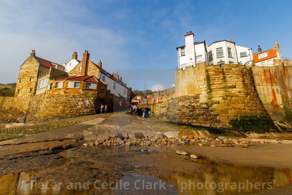 "Robin Hoods Bay, Yorkshire East Coast, England. A Panoramic View of the Village from the Beach Photographed 10th October 2010" by Peter and Cecile Clark - 'photographers' - $25.25 "Robin Hoods Bay, Yorkshire East Coast, England. A Panoramic View of the Village from the Beach Photographed 10th October 2010" stock image