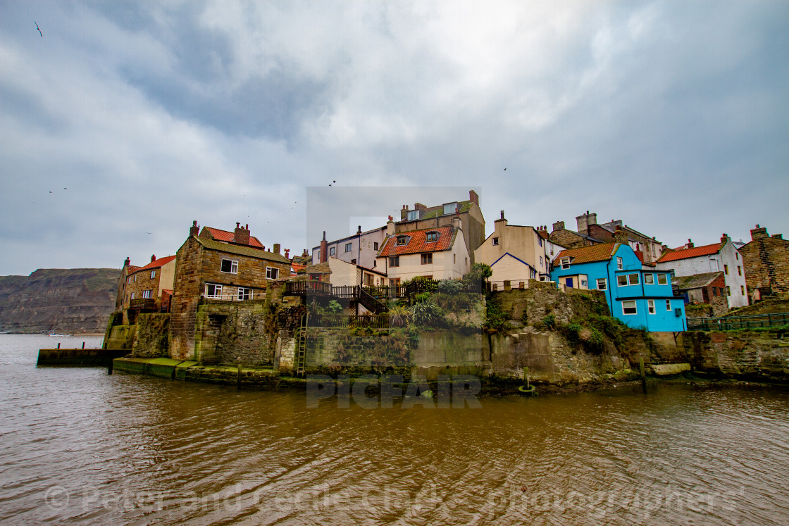 "Staithes at high tide, Yorkshire East Coast, England." stock image