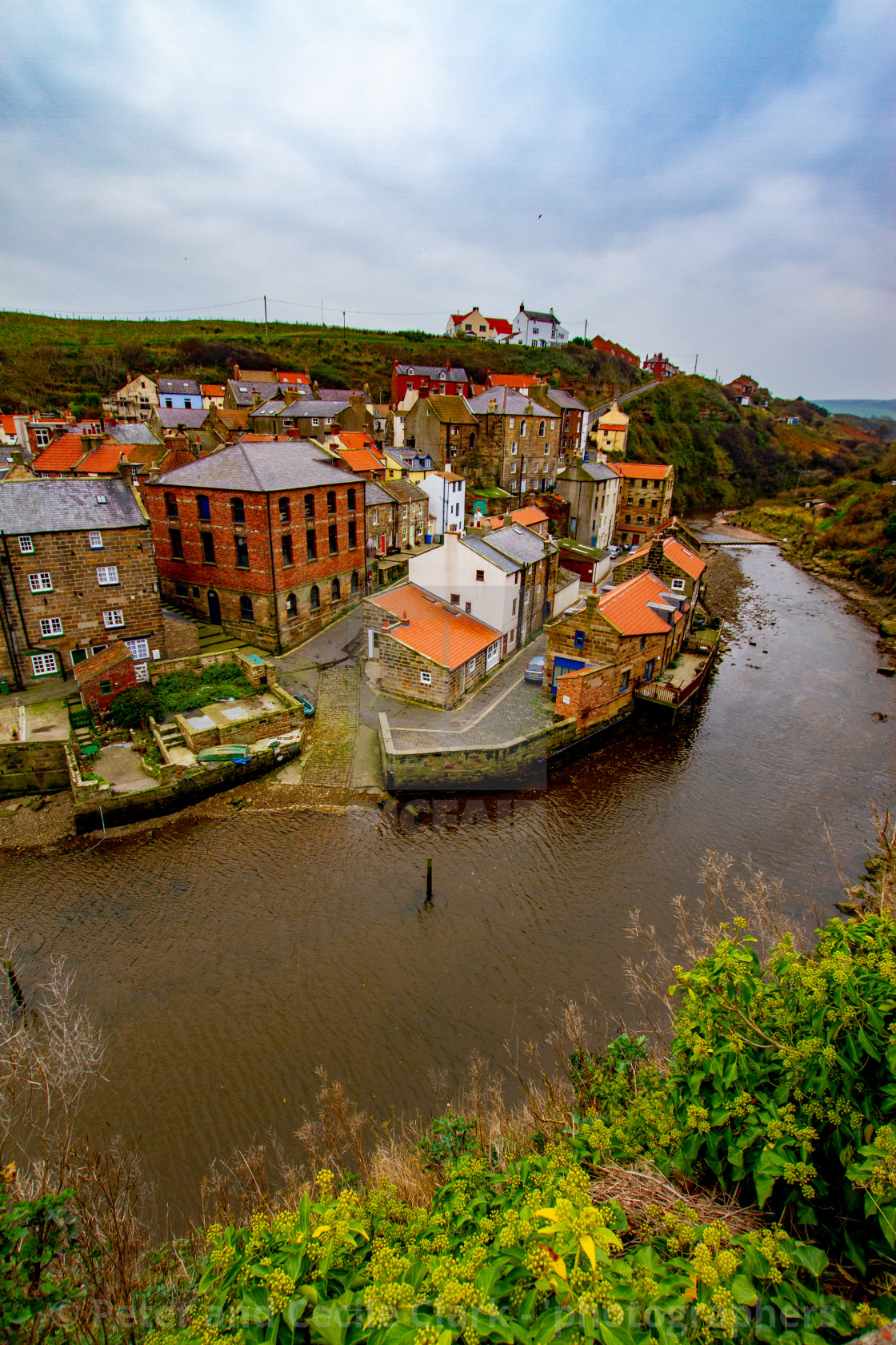 "View Overlooking Staithes Beck, Boat Slipway and Cottages" by Peter and Cecile Clark - 'photographers' - $25.25 "View Overlooking Staithes Beck, Boat Slipway and Cottages" stock image