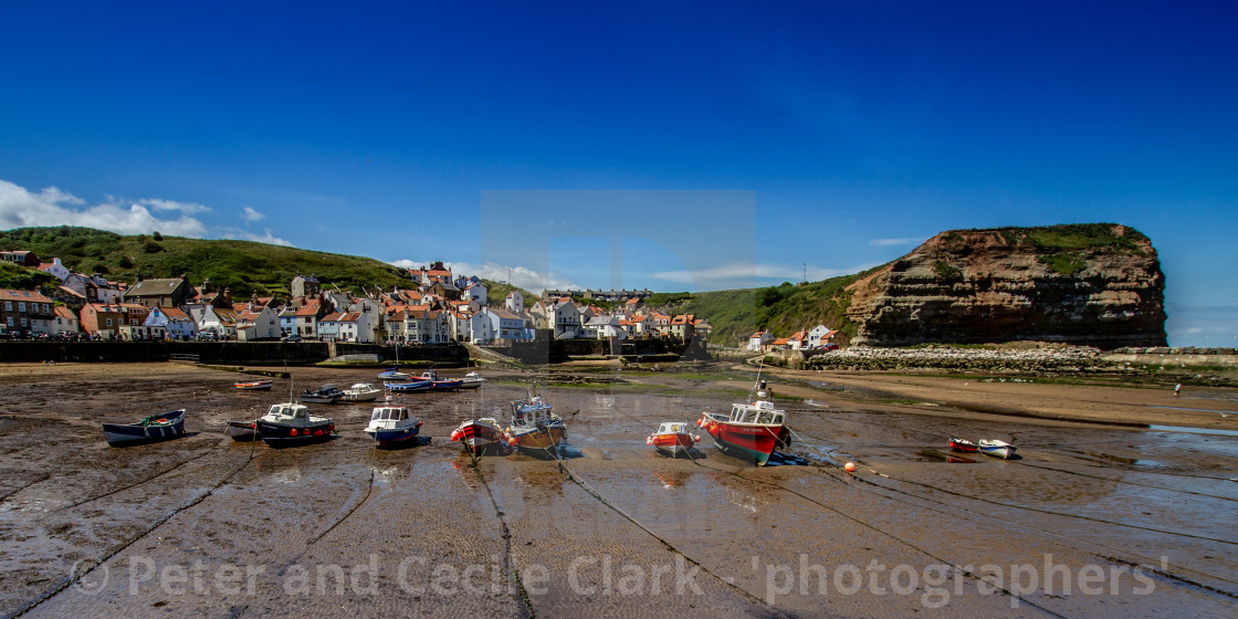 "Staithes and Cowbar Nab, Fishing Boats to the Foreground. Yorkshire Coast, England." stock image