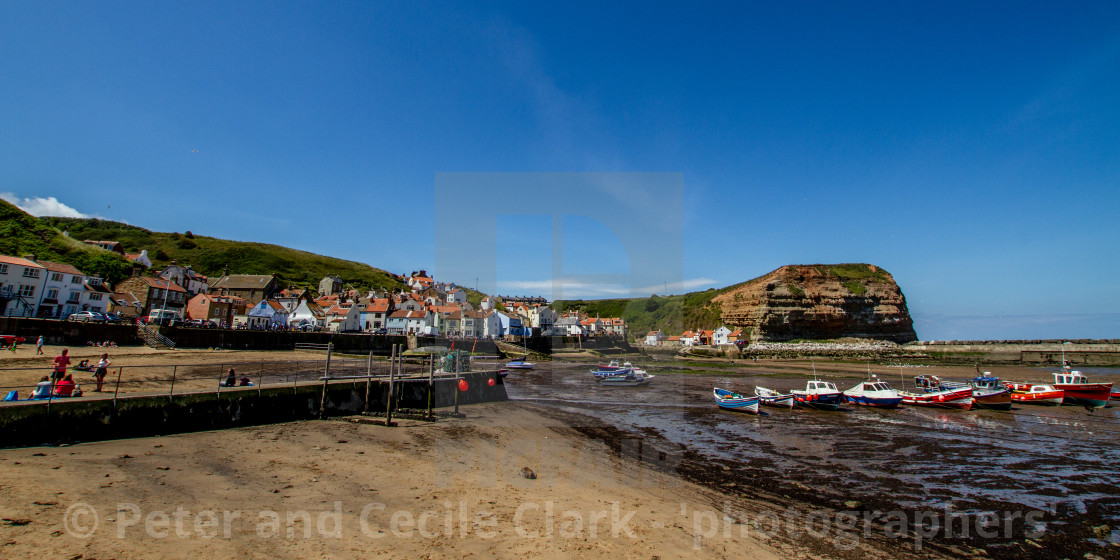 "Staithes and Cowbar Nab, Fishing Boats to the Foreground. Yorkshire Coast, England." stock image