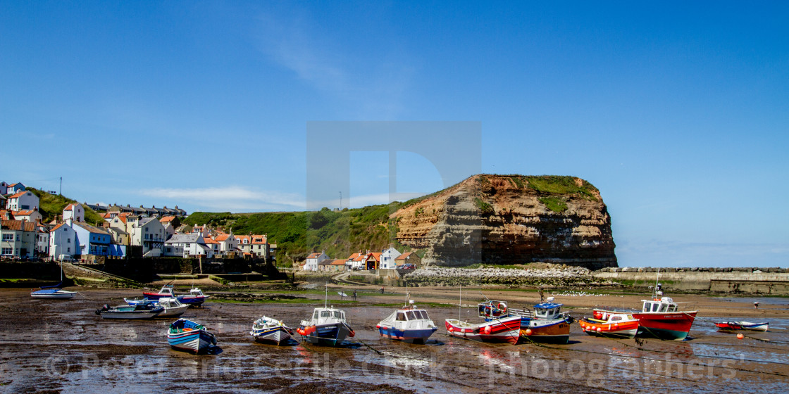 "Staithes and Cowbar Nab, Fishing Boats to the Foreground. Yorkshire Coast, England." stock image