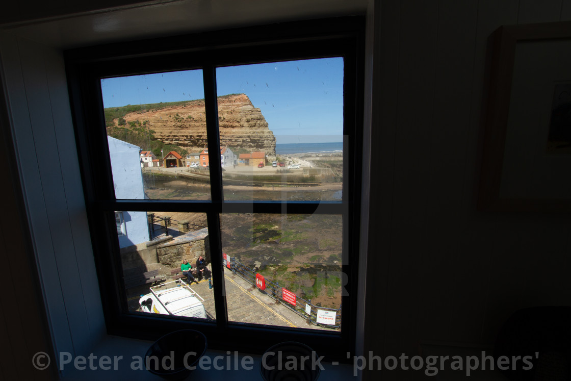 "Cod and Lobster Public House, High Street, Staithes, Yorkshire, England. View through First Floor Window. Photographed 03/07/2019" stock image