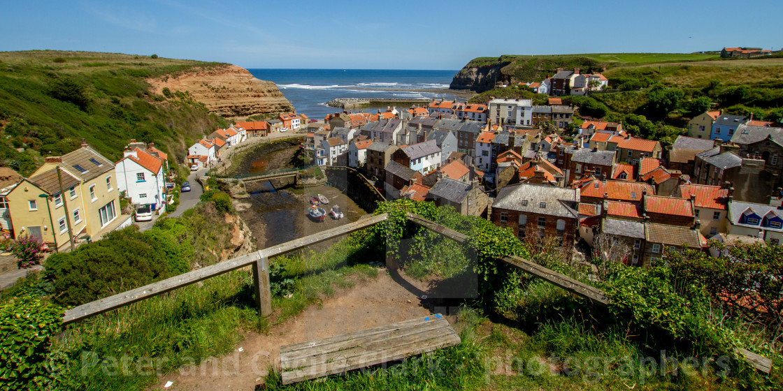 "View over Staithes, Northside and Staithes Beck- Cow Bar Nab, Harbour and North Sea in the Background. Yorkshire, England." stock image