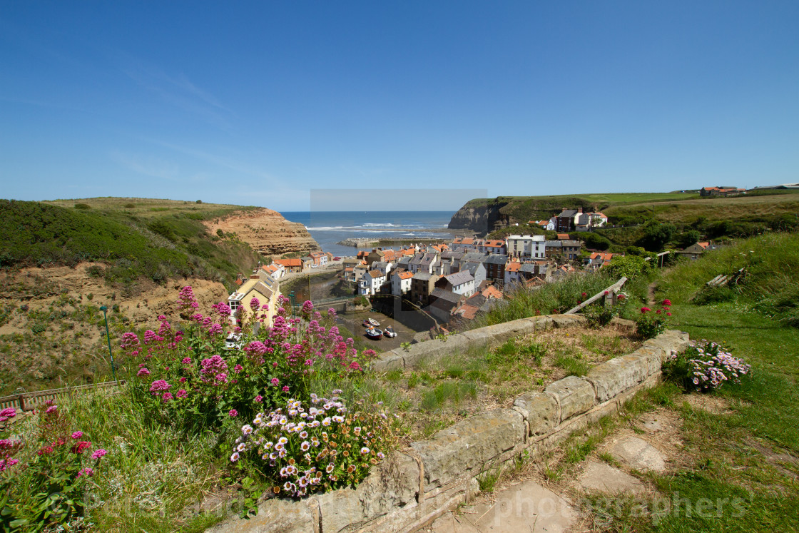 "View over Staithes, Northside and Staithes Beck- Cow Bar Nab, Harbour and North Sea in the Background. Yorkshire, England." stock image