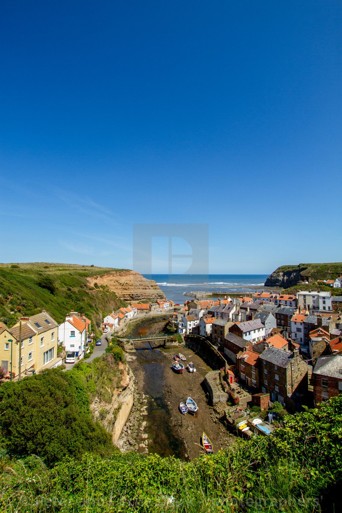 "View over Staithes, Northside and Staithes Beck- Cow Bar Nab, Harbour and North Sea in the Background. Yorkshire, England." stock image