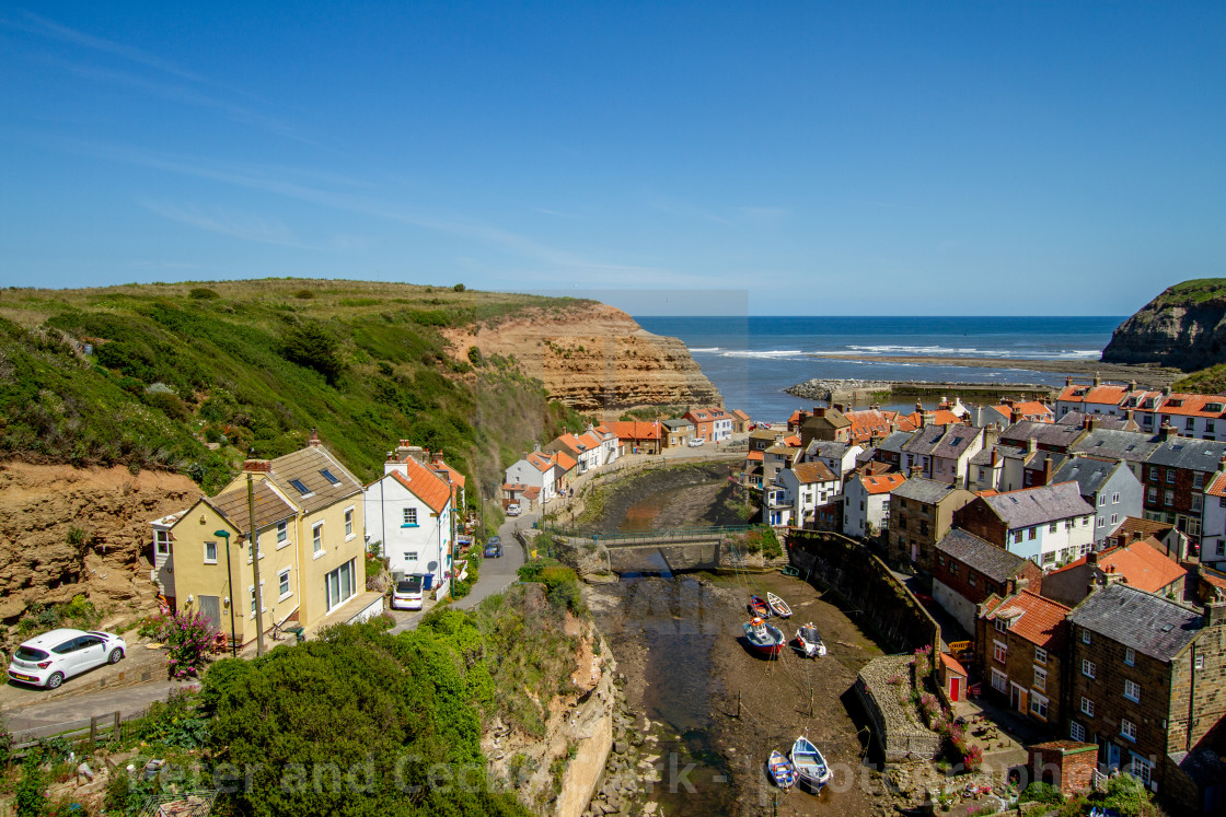 "View over Staithes, Northside and Staithes Beck- Cow Bar Nab, Harbour and North Sea in the Background. Yorkshire, England." stock image