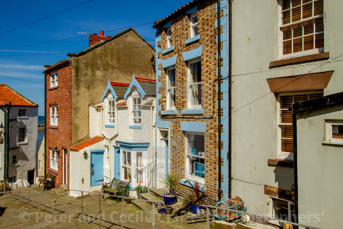 "Staithes, High Street Cottages and Houses in Sunshine. Yorkshire, England." stock image