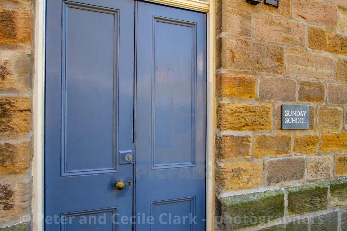 "Staithes, Sunday School Sign on Stone Wall, Yorkshire, England" stock image