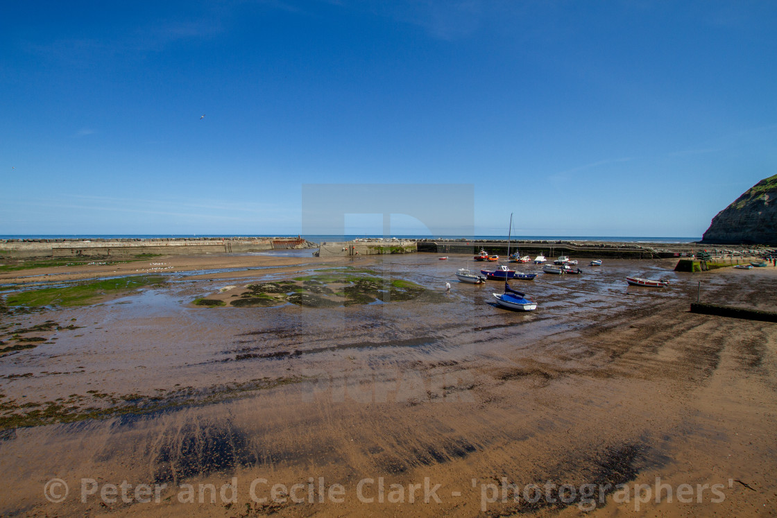 "Staithes Harbour at Low Tide, Yorkshire, England." stock image