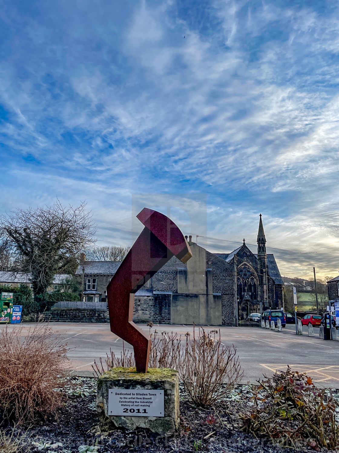 "Sculpture on plinth Dedicated to Silsden Town by the artist Sam Shendi, celebrating the Industrial History of Nail Making." stock image