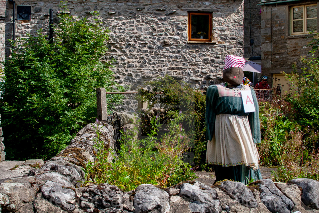 "Kettlewell Scarecrow Festival and Trail, Scarecrow in Garden. Yorkshire Dales, England." stock image