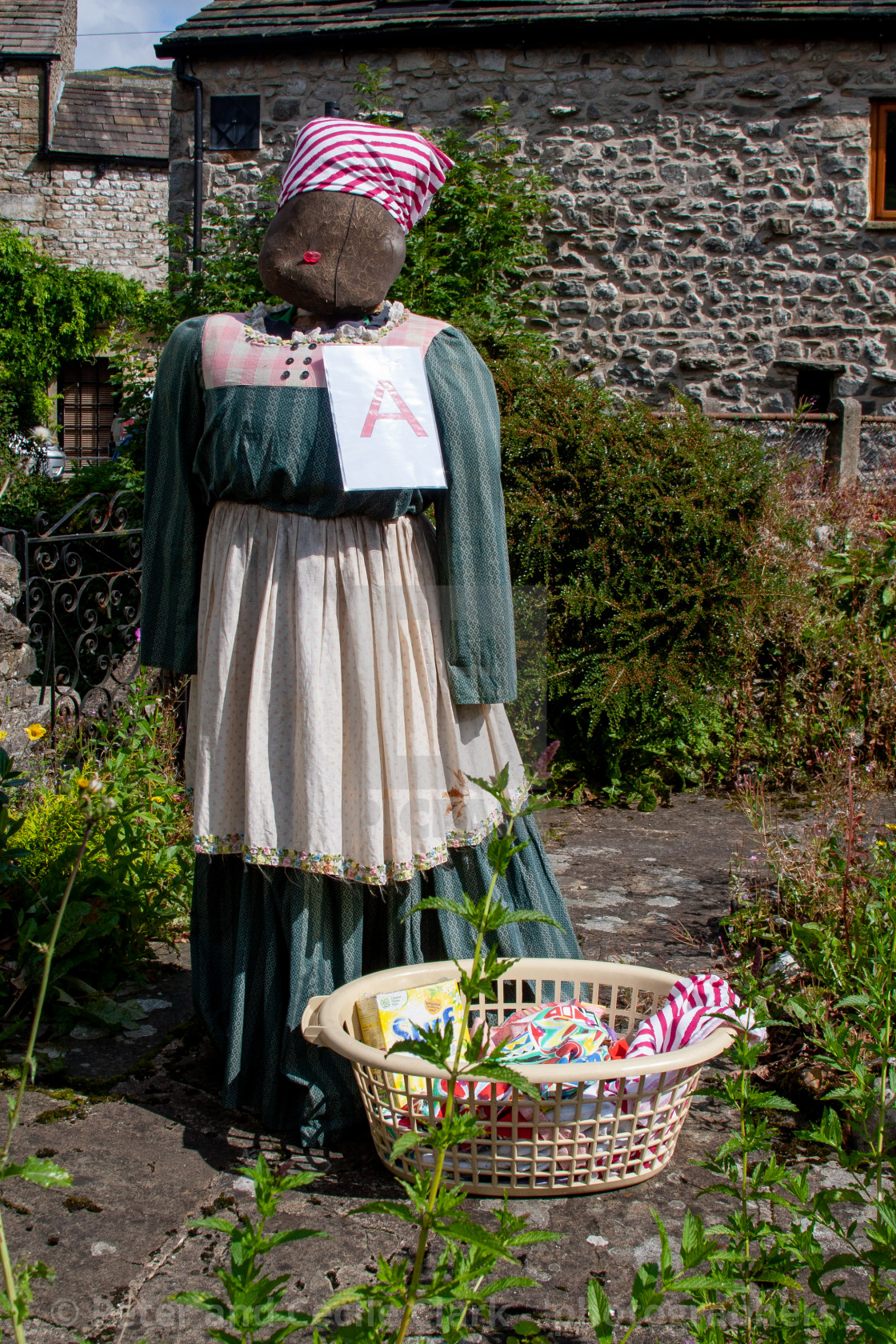 "Kettlewell Scarecrow Festival and Trail, Scarecrow with Washing. Yorkshire Dales, England." stock image
