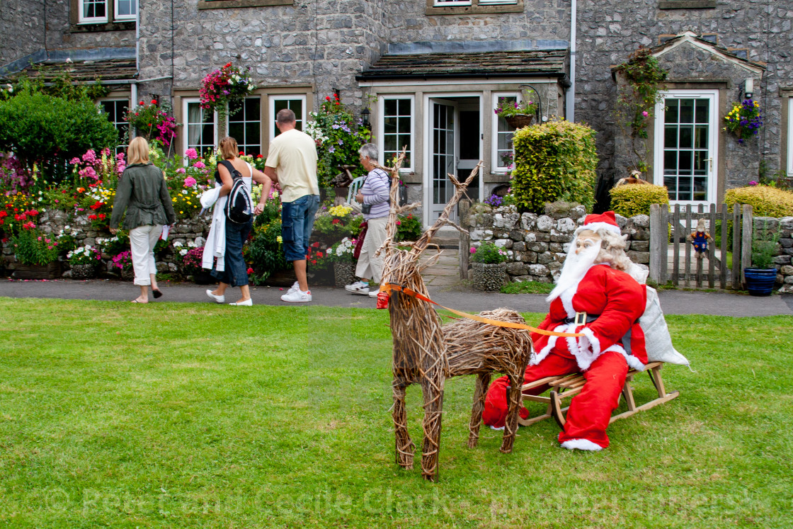 "Kettlewell Scarecrow Festival and Trail, Santa on Sleigh. Yorkshire Dales, England." by Peter and Cecile Clark - 'photographers' - $8.89 "Kettlewell Scarecrow Festival and Trail, Santa on Sleigh. Yorkshire Dales, England." stock image