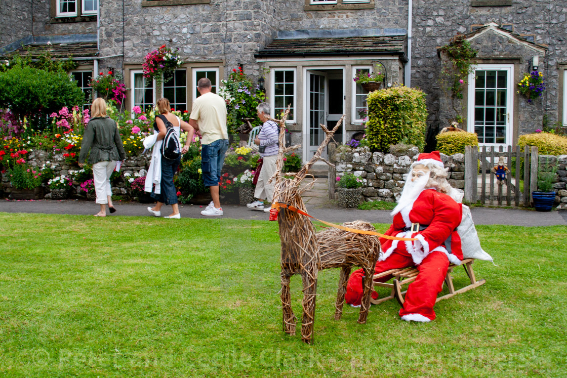 "Kettlewell Scarecrow Festival and Trail, Santa on Sleigh. Yorkshire Dales, England." stock image