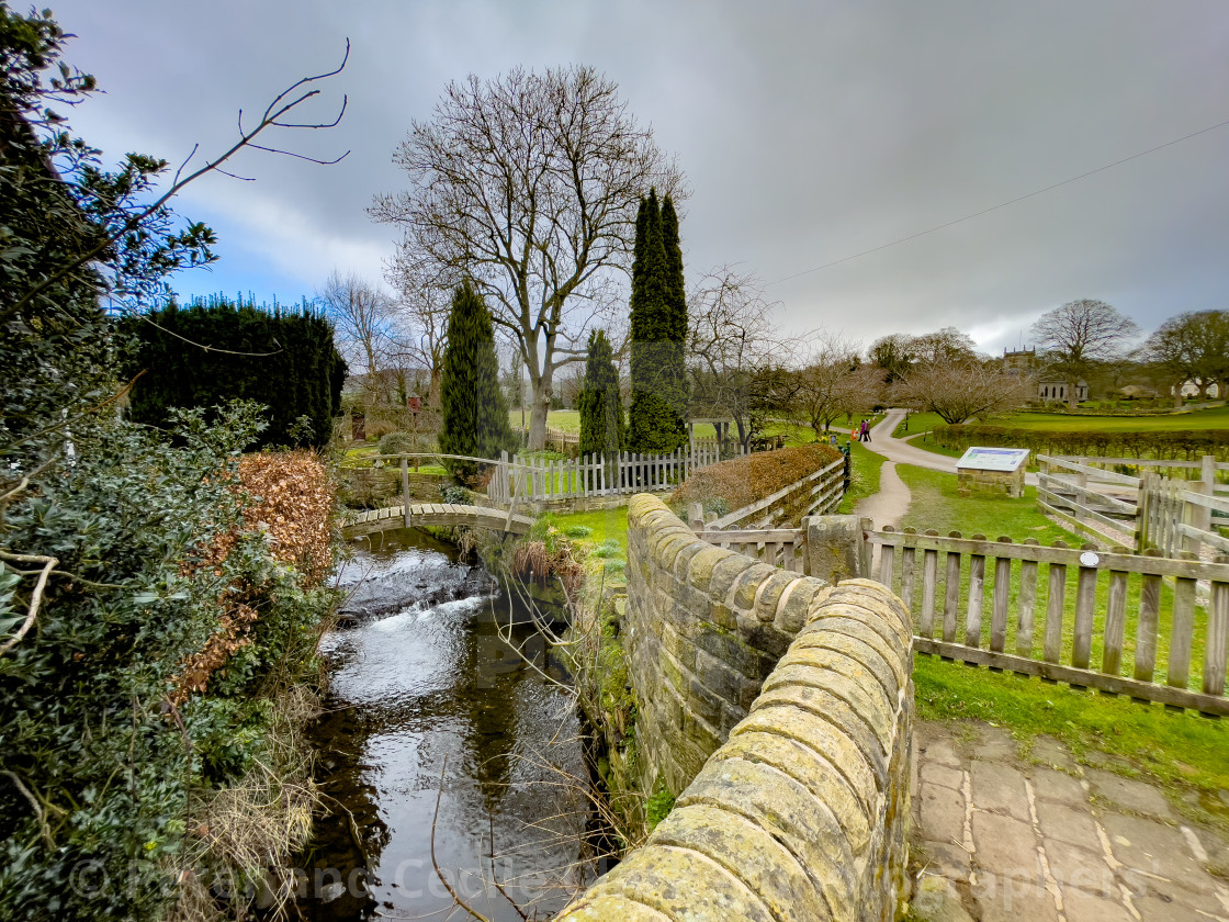 "Pathway leading to St Peter's Church is a Church of England parish church in the village of Addingham, West Yorkshire. England. A grade 1 listed building" stock image