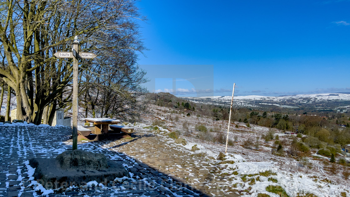 "View from White Wells, Rombalds Moor, Ilkley, Yorkshire, England, UK. Snow on the ground. Photographed 11th April 2021." stock image