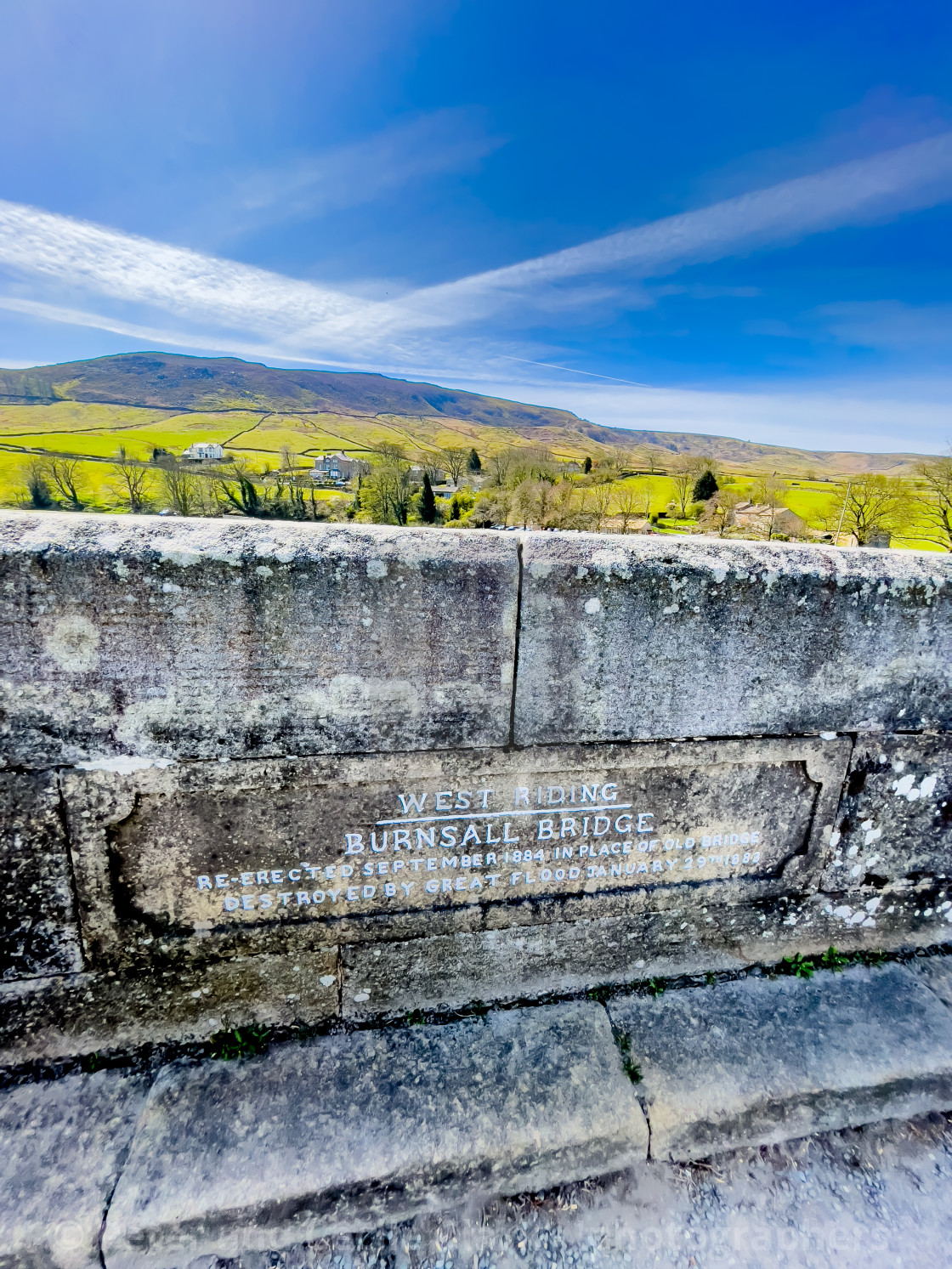 "Burnsall, Yorkshire, River Wharfe Burnsall Bridge inscription in stonework." stock image