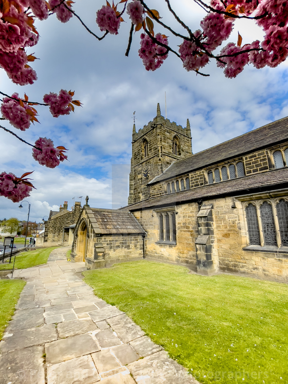 "All Saints Parish Church with Cherry Blossom Ilkley" stock image