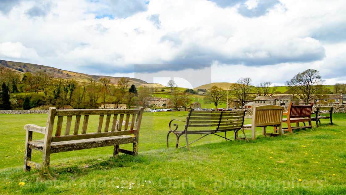 "Seats overlooking Burnsall Village Green in Yorkshire Dales." stock image