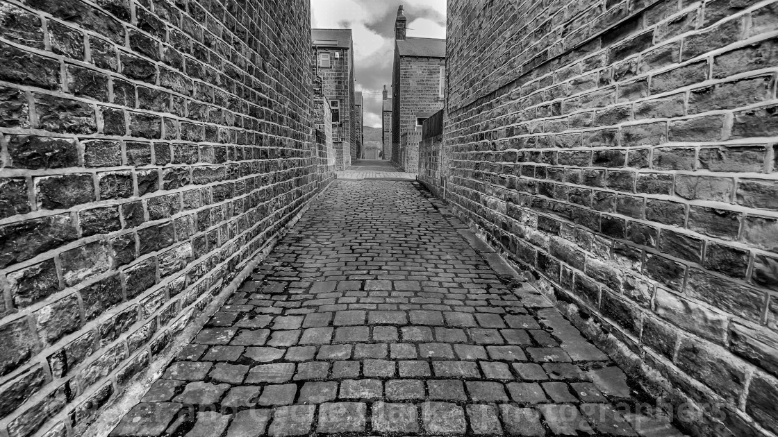 "Stone Setts in Passage. Silsden, Cobbydale, Yorkshire, England. Photographed 18th February 2021. Monochrome." stock image