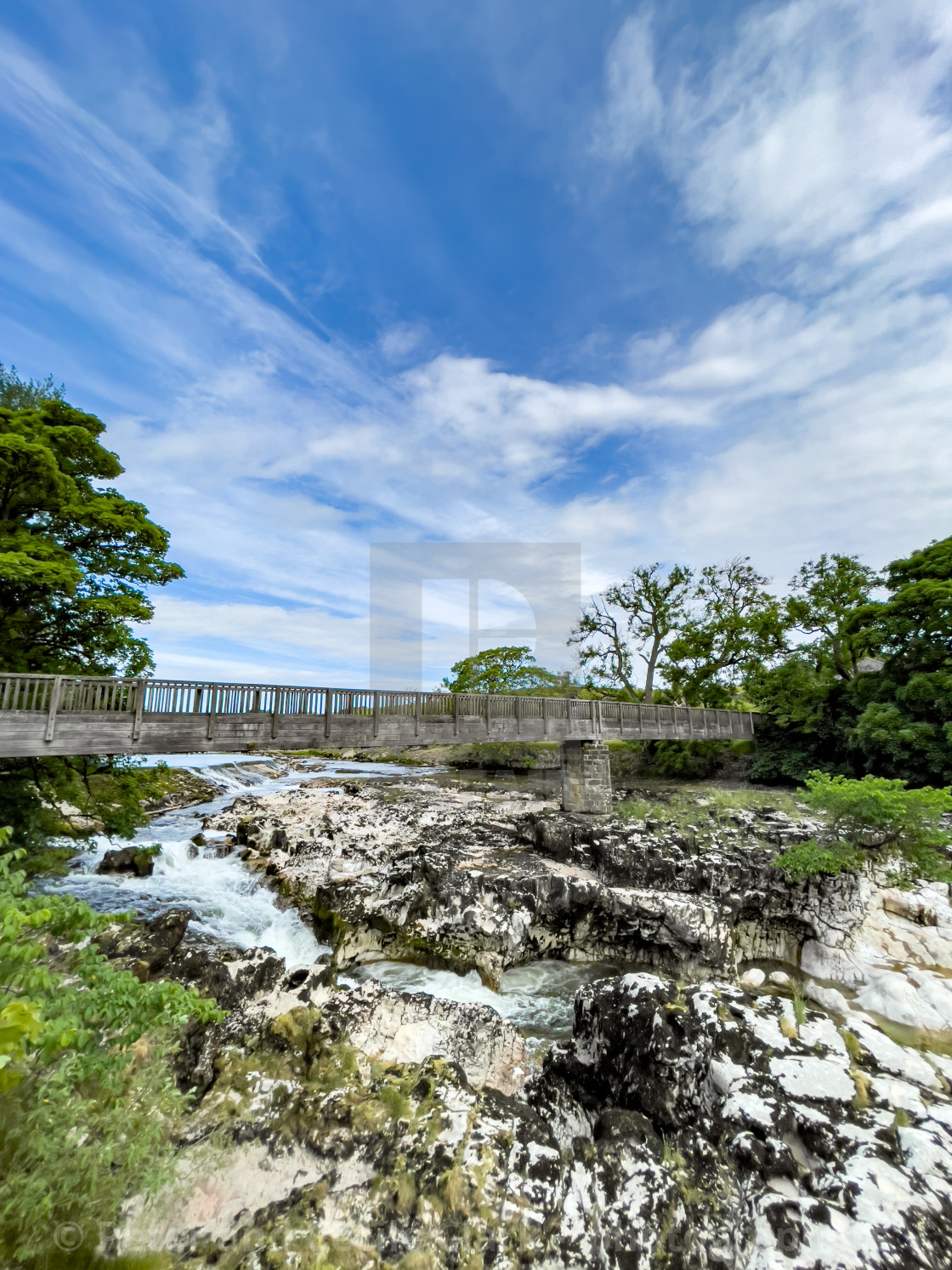 "Linton Lower Falls and Footbridge, River Wharfe." stock image