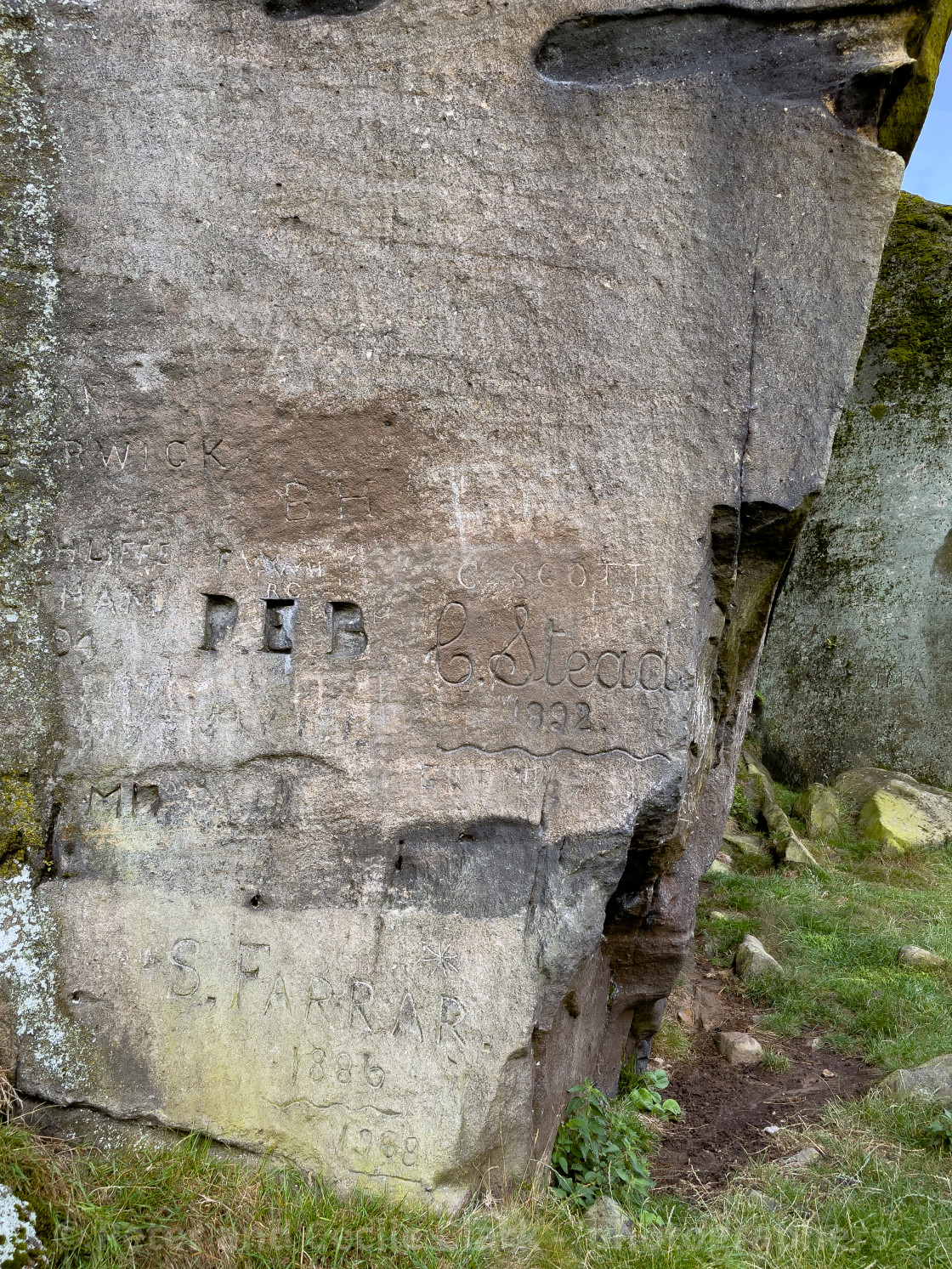 "Cow and Calf Rocks, Name Carving, Ilkley." by Peter and Cecile Clark - 'photographers' - $25.25 "Cow and Calf Rocks, Name Carving, Ilkley." stock image