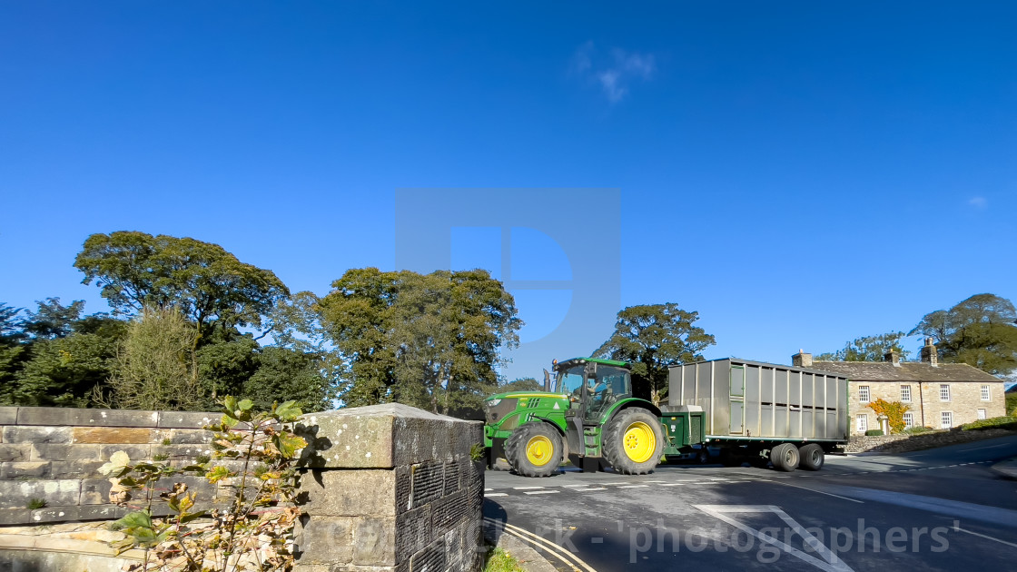 "Linton in Craven Bridge, built 1892, green tractor crossing" stock image