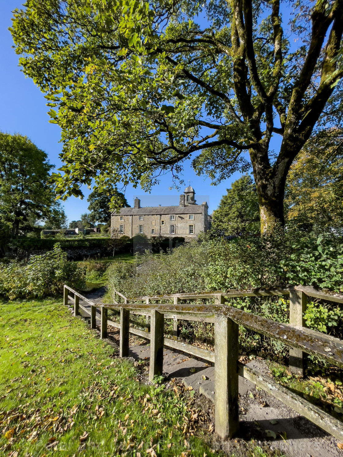 "Linton in Craven, footpath to Clapper Bridge and Fountaine Hospital Almshouse." stock image