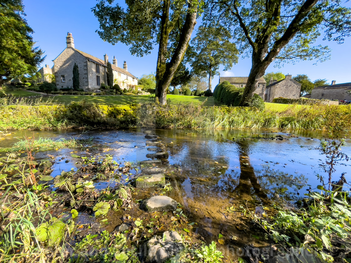 "Idyllic Yorkshire Cottage, Stream and Stepping Stones over Linton Beck." stock image