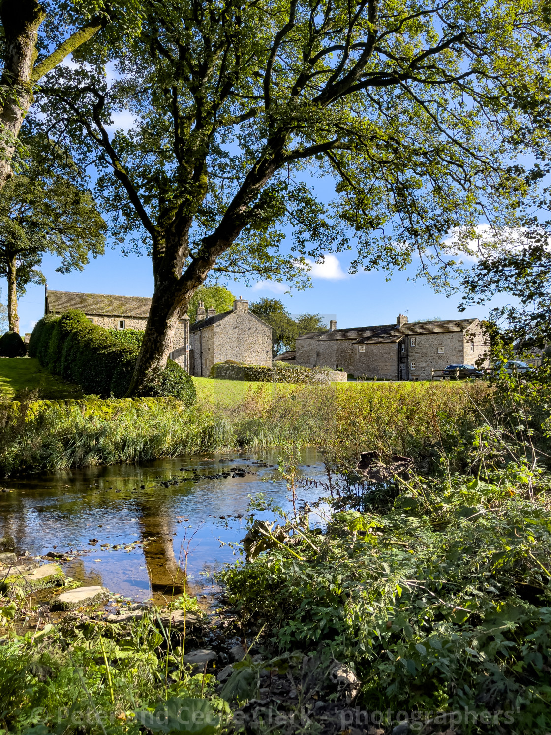 "Idyllic Yorkshire Cottage, Stream and Stepping Stones over Linton Beck." stock image