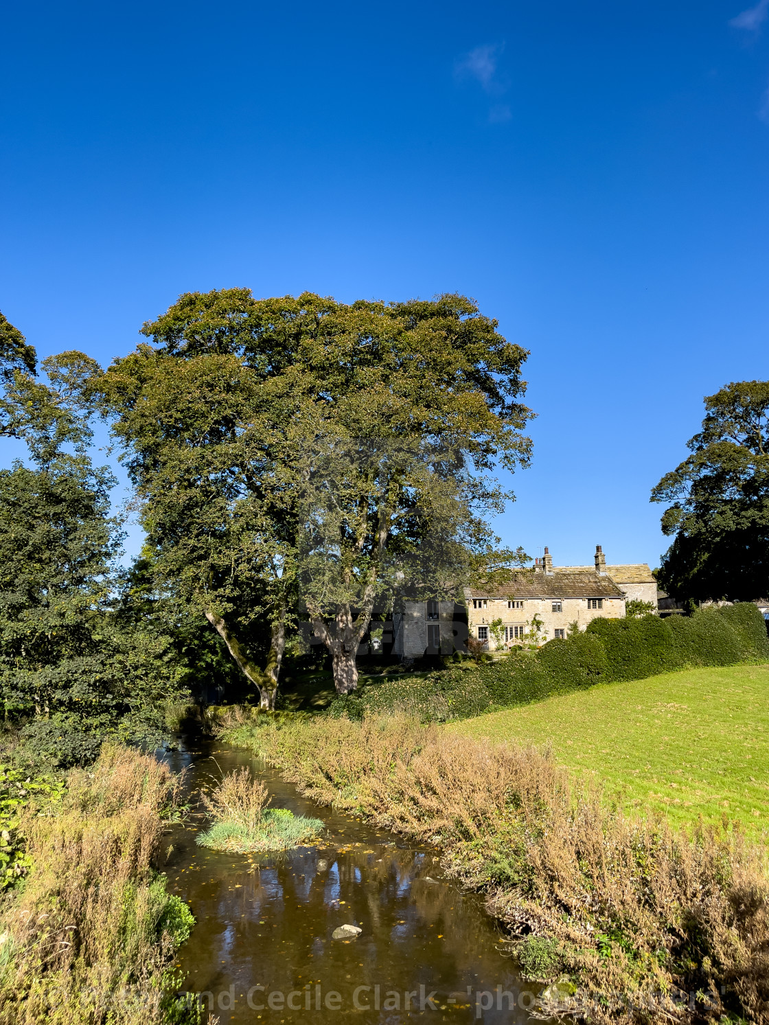 "Idyllic Yorkshire Cottage and Stream" stock image