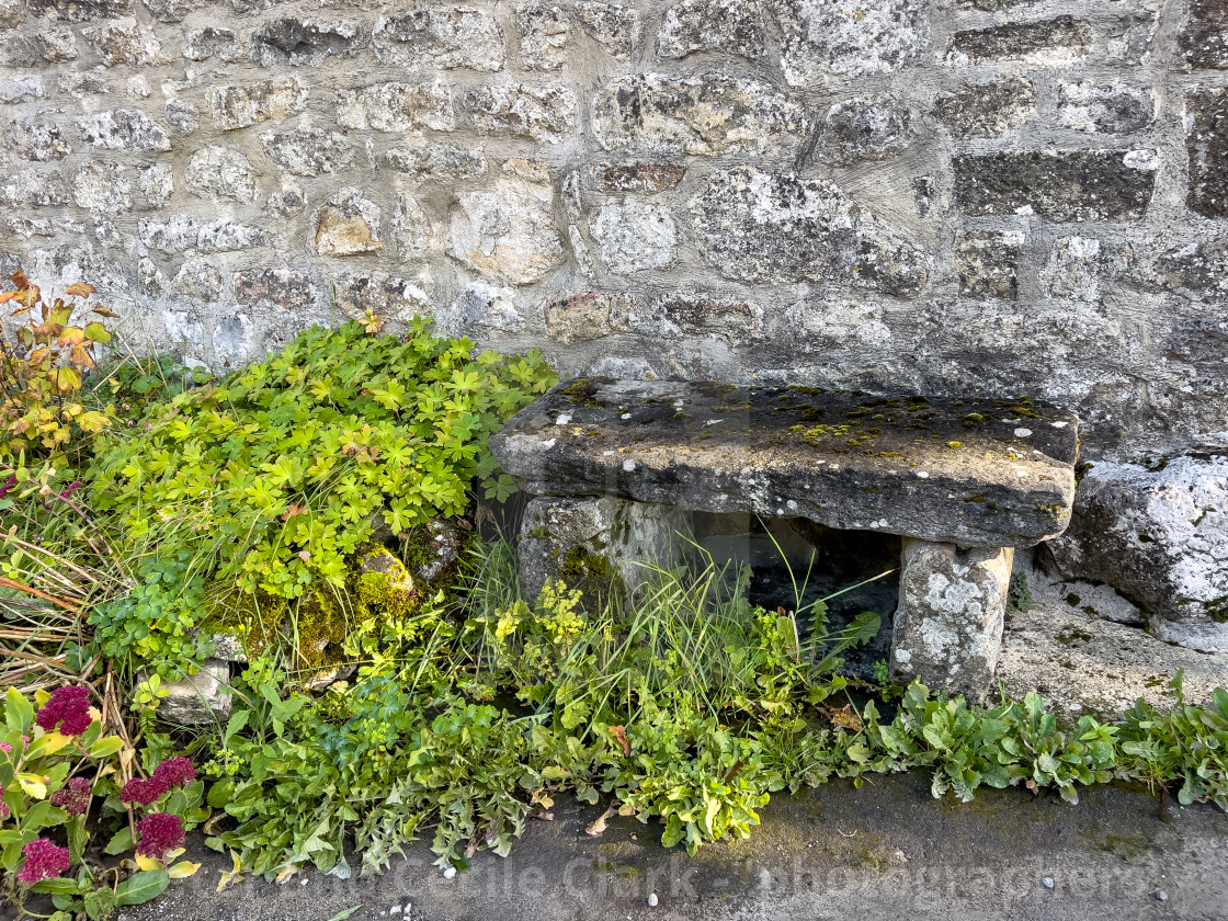 "Stone Milk Churn Bench. Linton in Craven." stock image