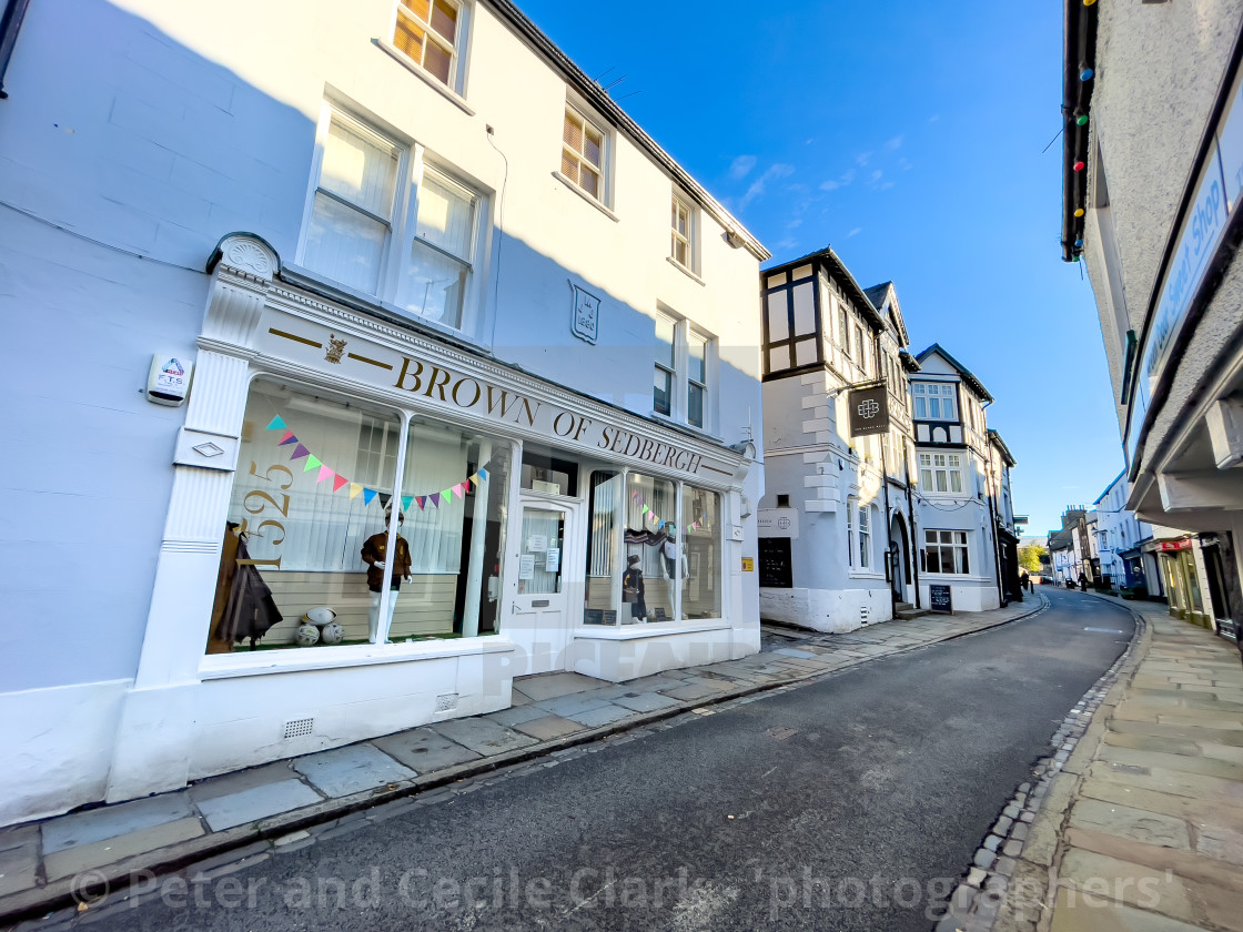 "Brown of Sedbergh Shop and Main Street, School Outfitter." stock image