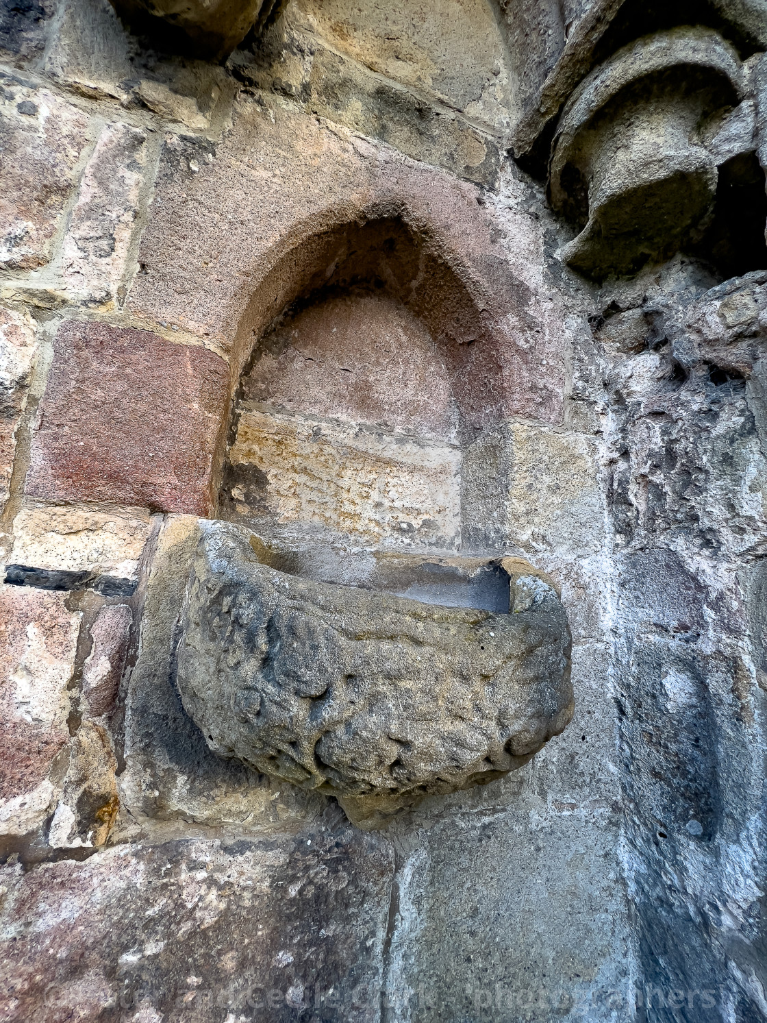 "Holy Water Stoup, Bolton Abbey Priory." stock image