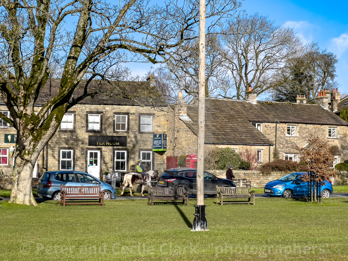 "Horse and Rider in Burnsall a Yokshire Dales Village." stock image