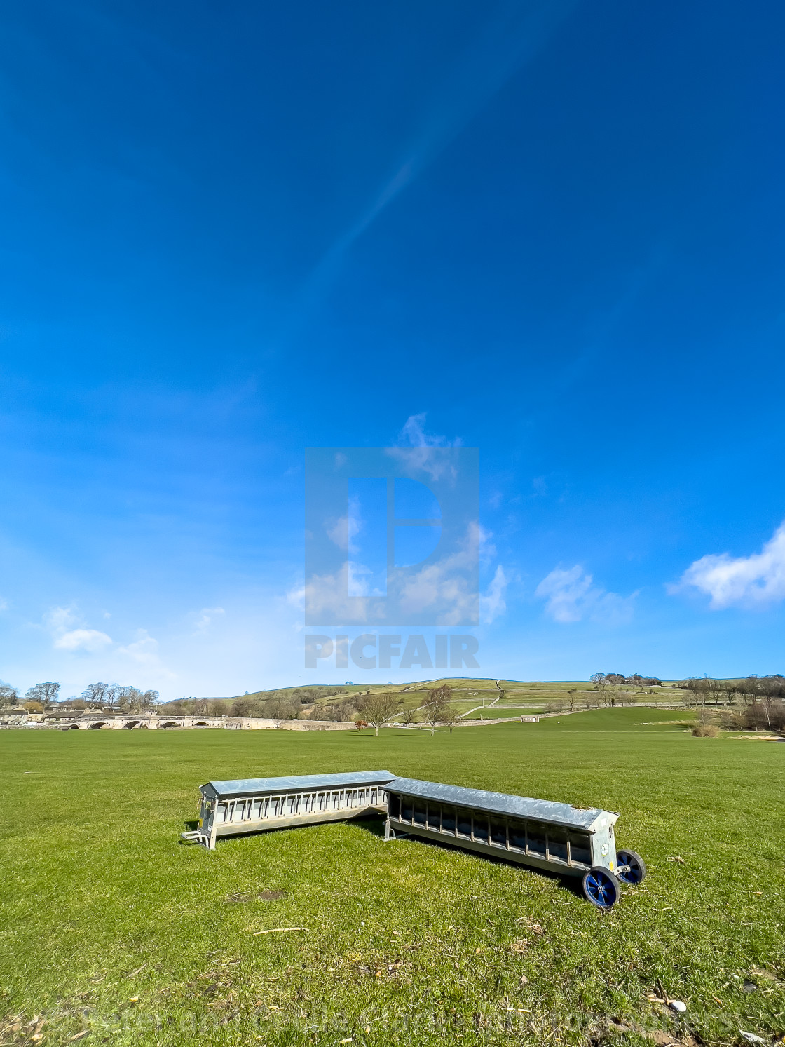 "Lamb Creep Feeders next to River Wharfe at Burnsall" stock image