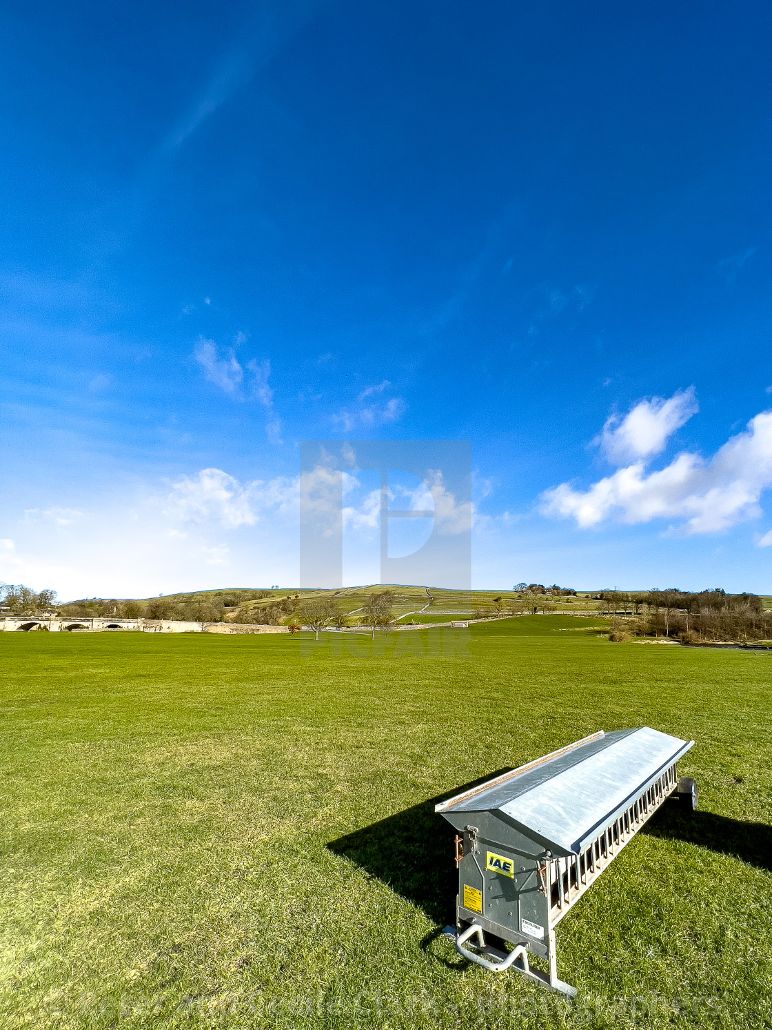 "Lamb Creep Feeder next to River Wharfe at Burnsall" stock image