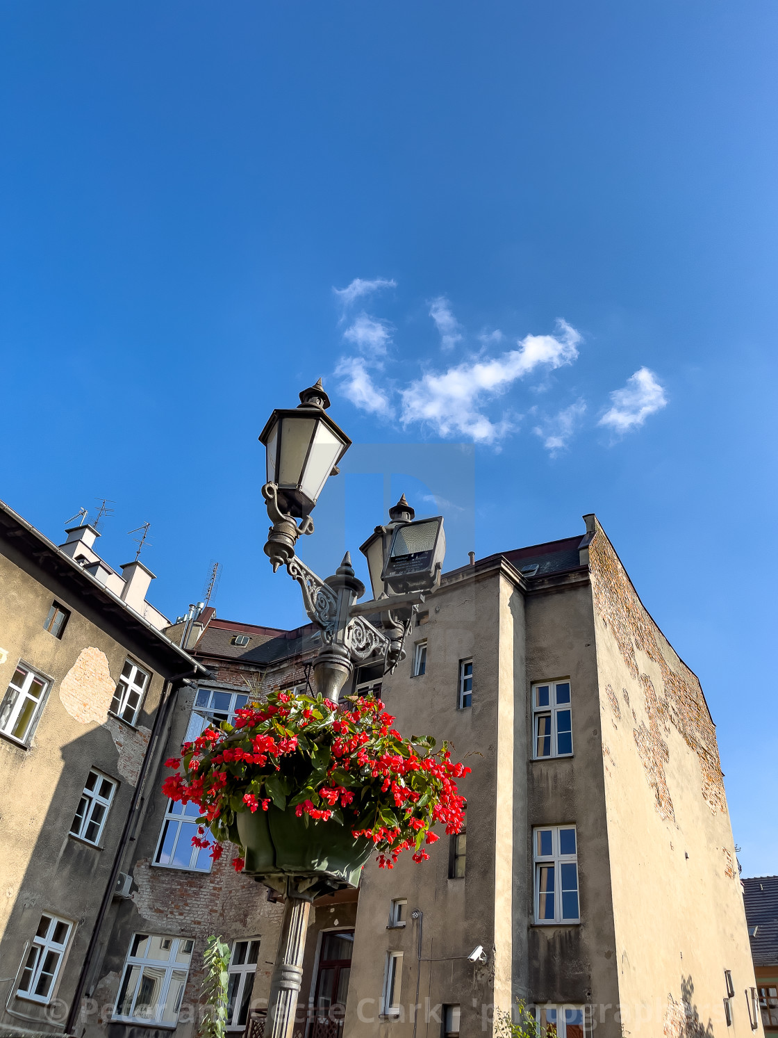 "Apartments and Colourful Flower Basket, Gliwice." stock image