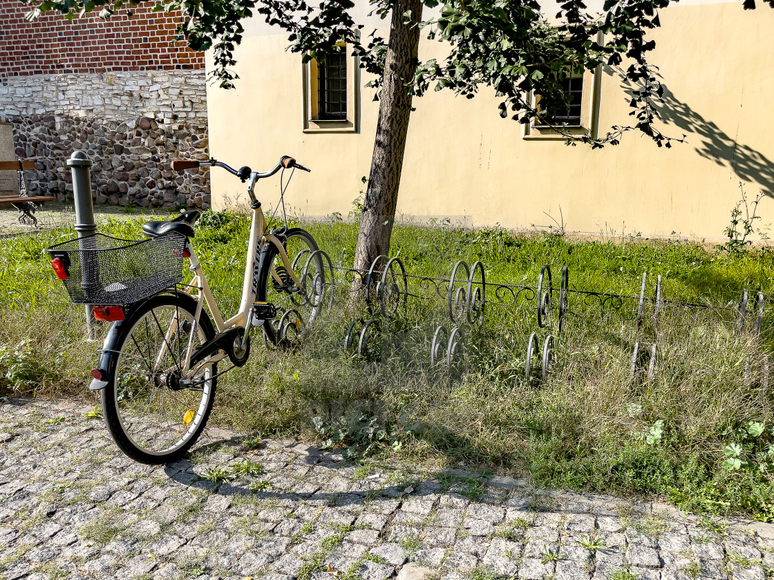 "Bicycle Parked on Cobbles, Gliwice." stock image