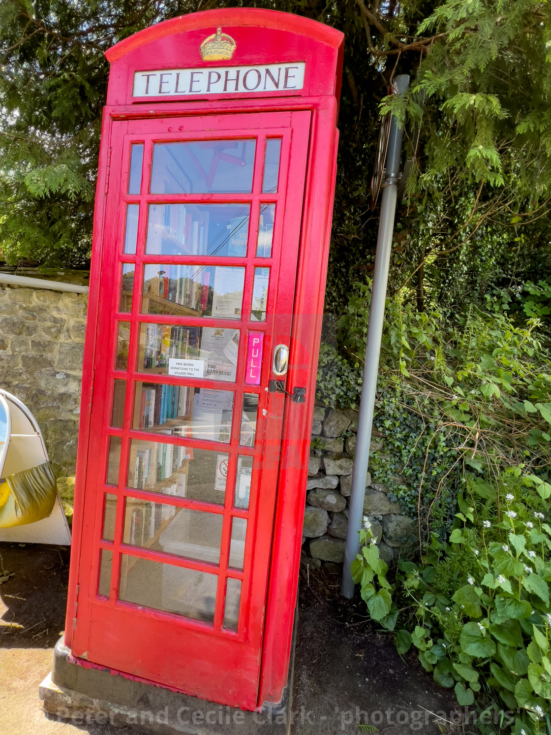 "Red Telephone Box Library, Hebden, Yorkshire Dales." stock image