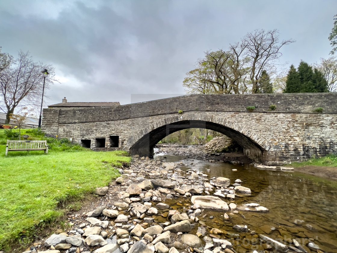 "Hardraw Beck, Arched Stone Bridge." by Peter and Cecile Clark - 'photographers' - $12.21 "Hardraw Beck, Arched Stone Bridge." stock image