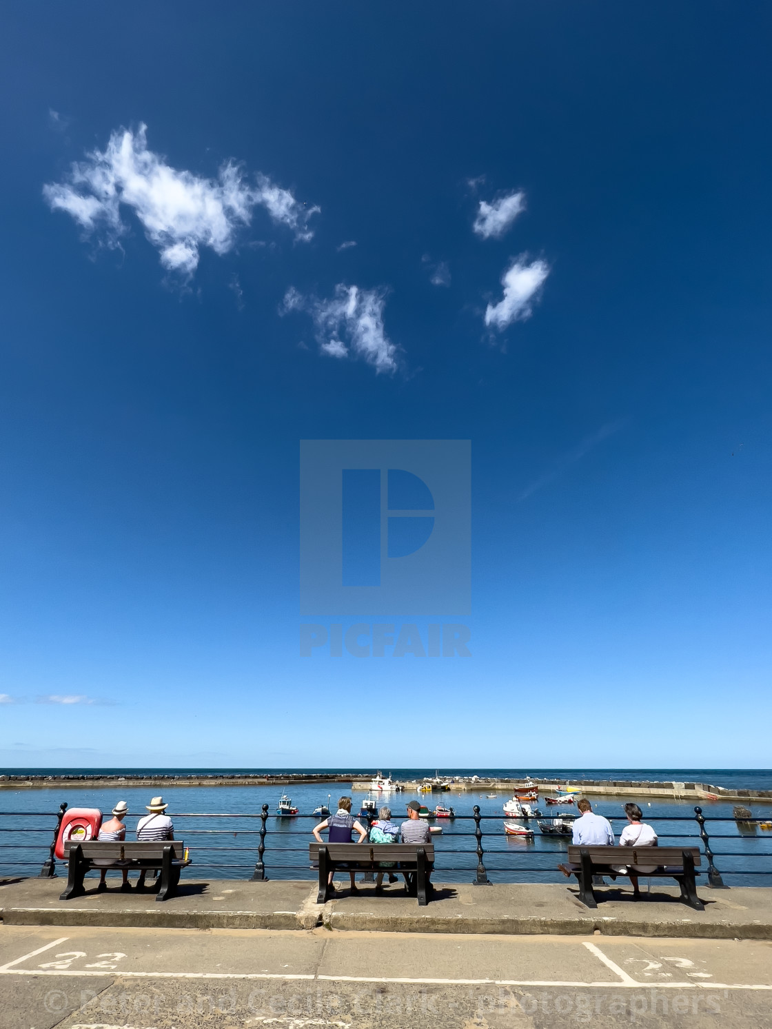 "Staithes, relaxing in sunshine, overlooking the harbour." stock image