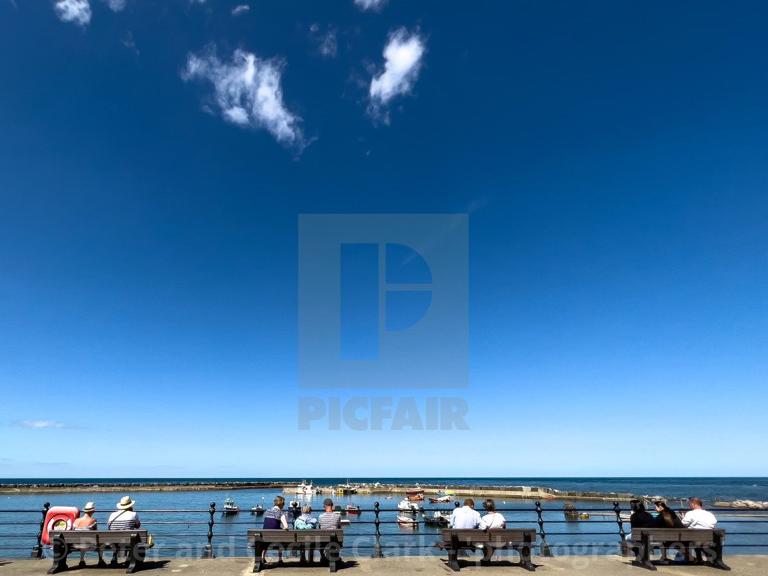 "Staithes, relaxing in sunshine, overlooking the harbour." stock image